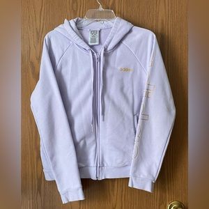 Adidas zip up hoodie in lavender with gold adidas on front and down sleeve.
